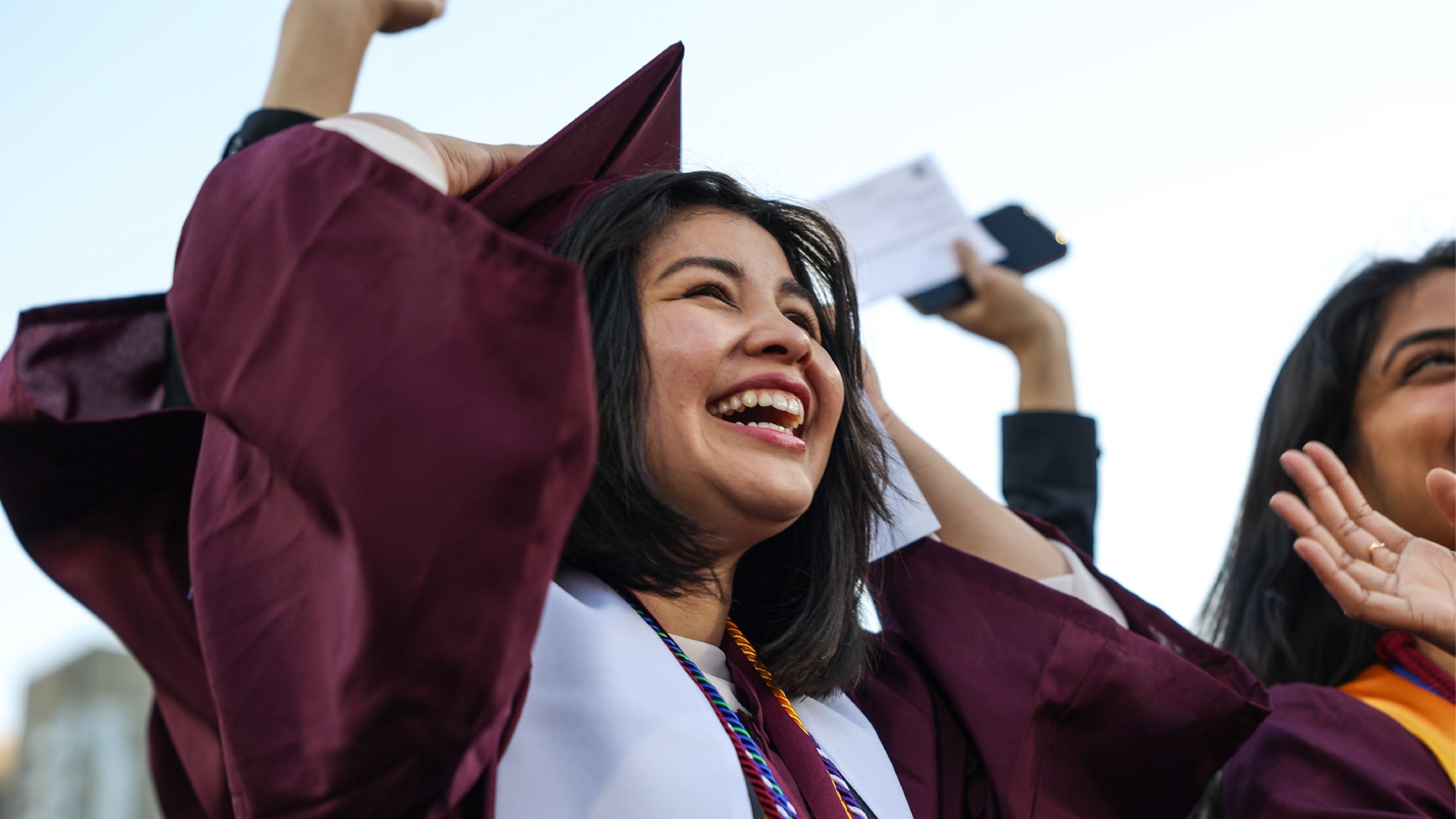 An ASU Graduate cheering during the ceremony