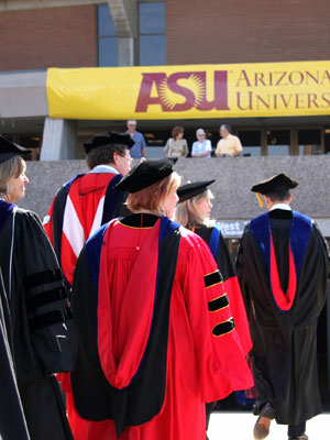 ASU Deans wearing a cap and gown
